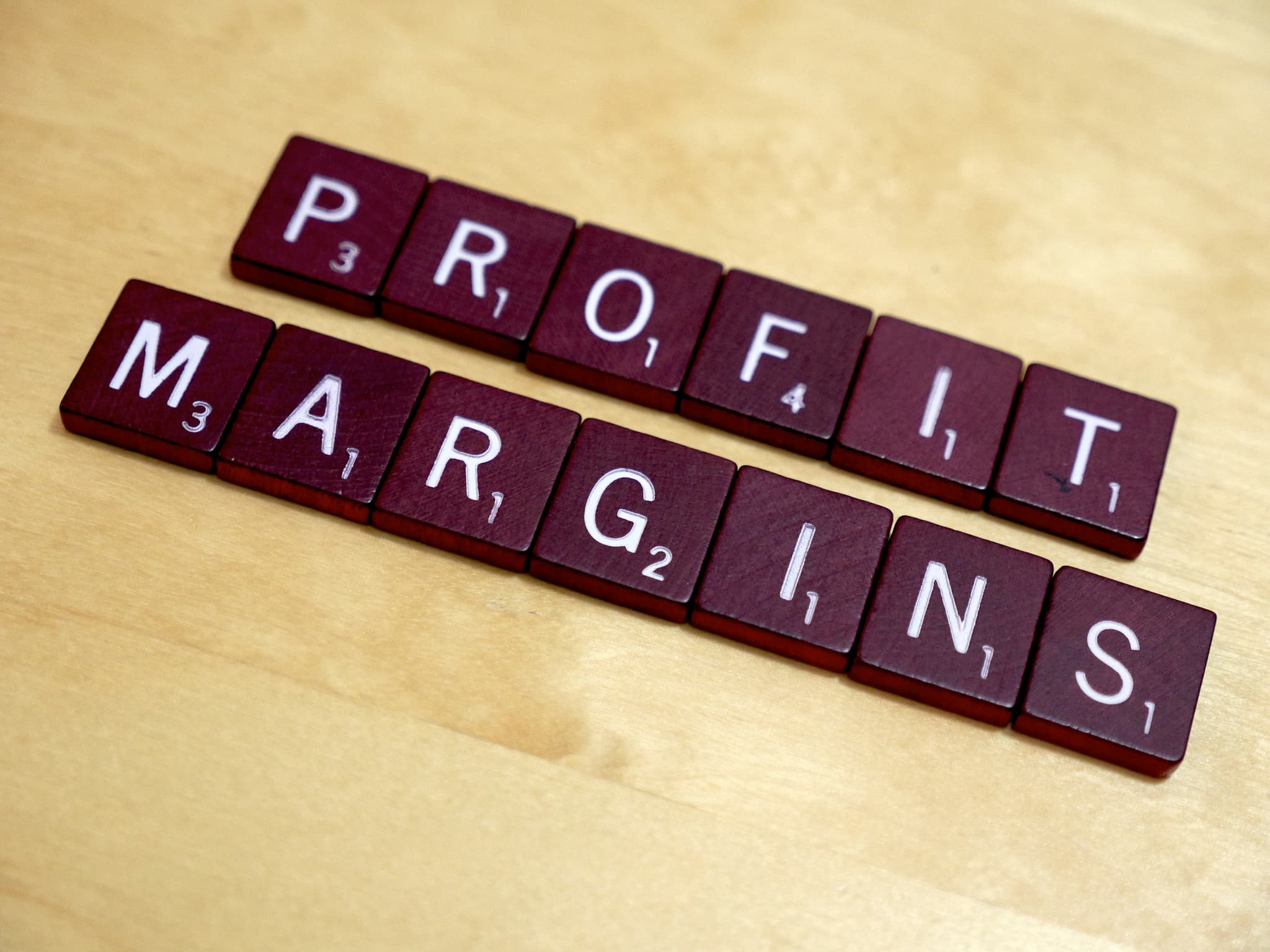 profit margin spelled out in scrabble letters