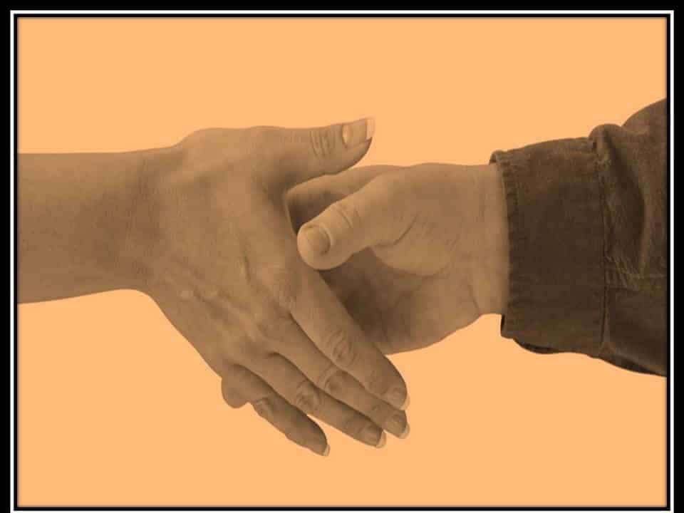 photo of man and woman shaking hands