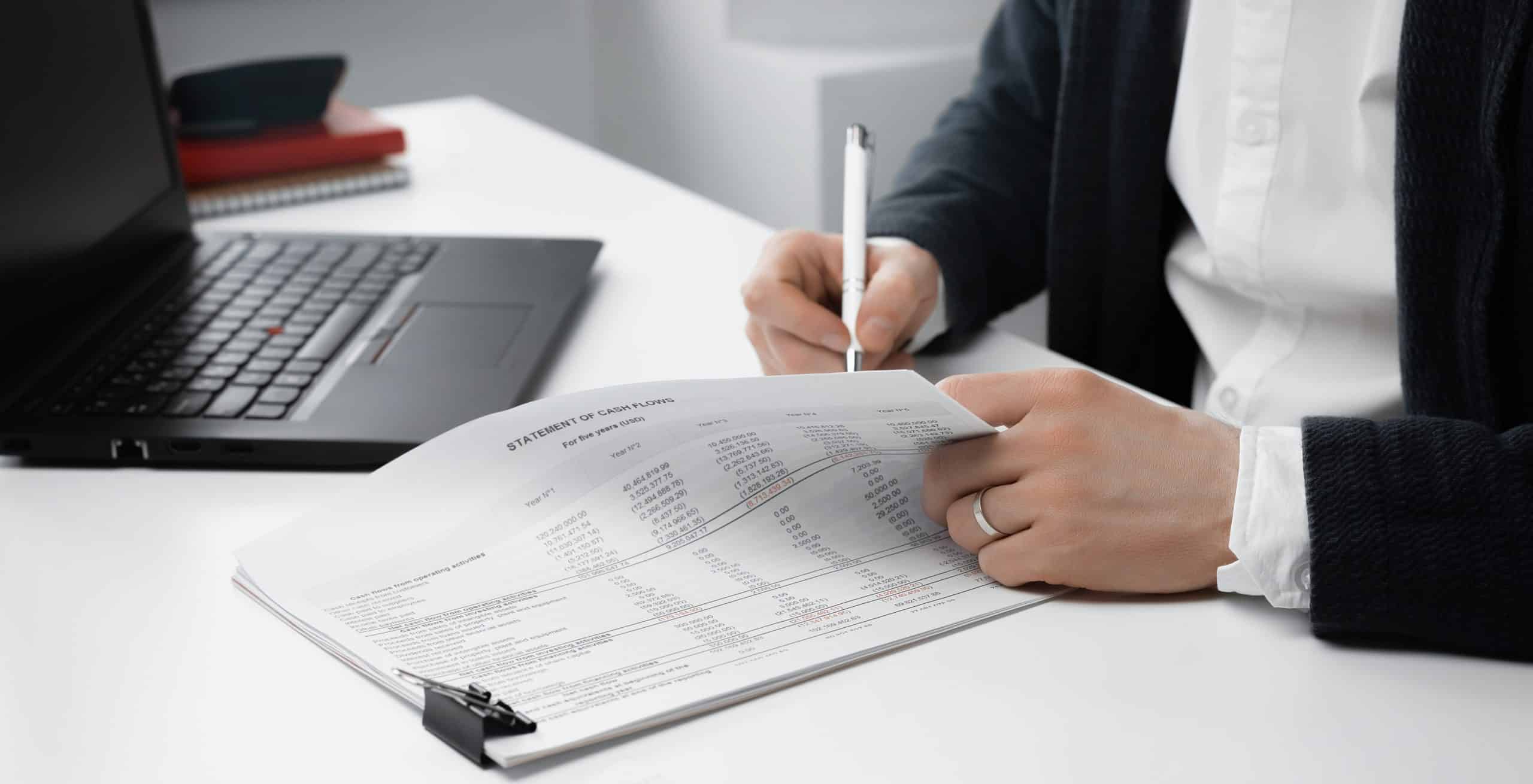 view of businessman signs a document or contract. Finance concept